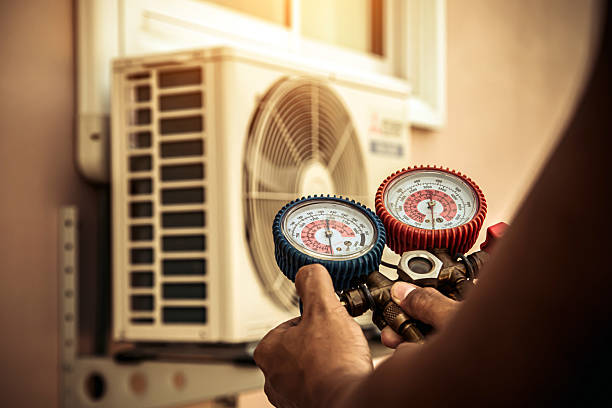 Professional Air Conditioning Service technician working in New Straitsville, OH